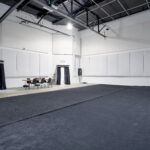 A creative space in Berkeley featuring a sounds studio with carpeted floor and sound attenuation.